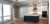 A modern home features an open concept kitchen space with white cabinetry.