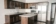 Dark Kitchen Cabinets with Light Laminate Countertops