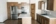 Dark Kitchen Cabinets with Light Laminate Countertops and Grey Subway Tile Backsplash