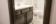 Dark Cabinets, White Laminate Countertops with Chrome Fixture Bathroom